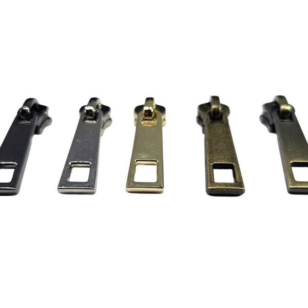 Schuivers en stoppers voor metalen ritsen